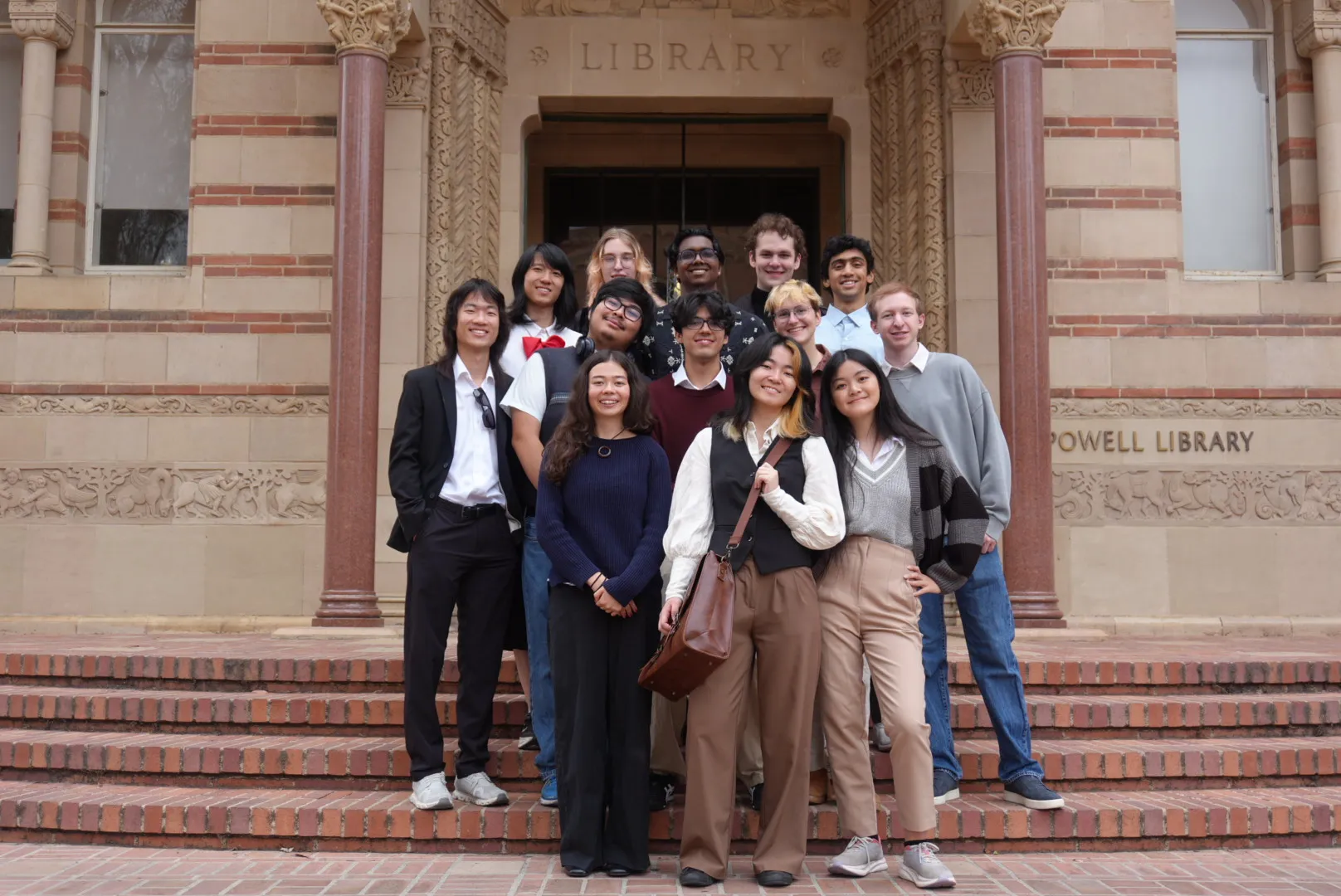 The 2026–2027 Enigma officers on the steps of Powell Library